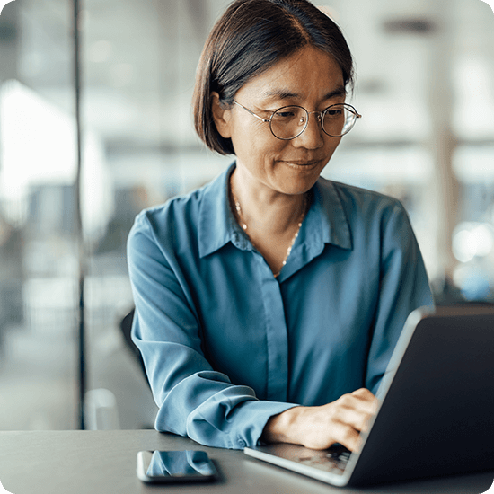 Woman typing on a computer