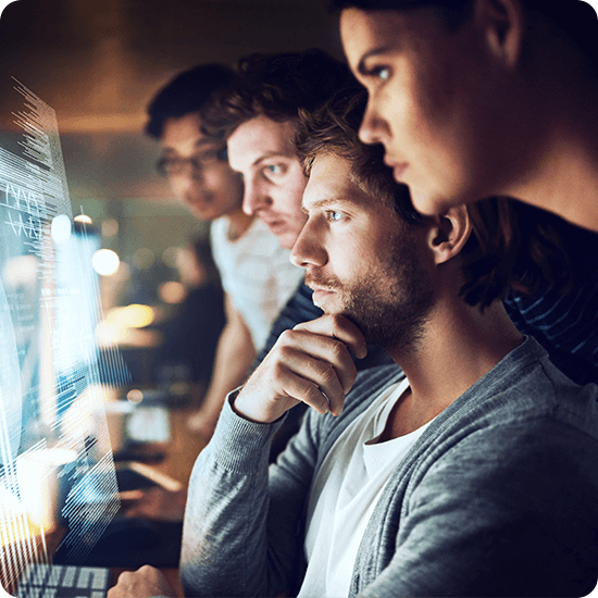 Several people looking intently at computer screens