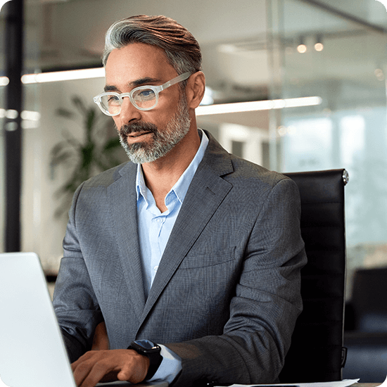 A man typing at a computer