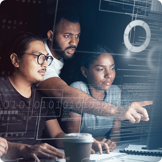 Several people working in front of a computer