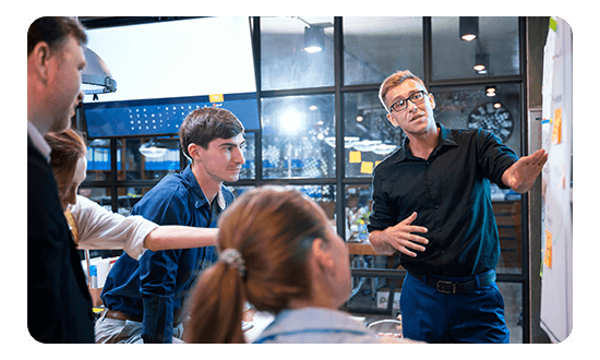 Group of people looking at a whiteboard