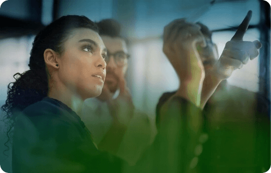 People gathered around a digital whiteboard